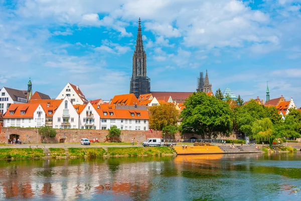 stock image Cityscape of German town Ulm reflecting on river Danube.