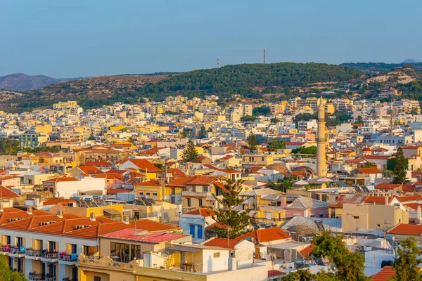 stock image Sunset view of rooftops of Greek town Rethimno at Crete island.