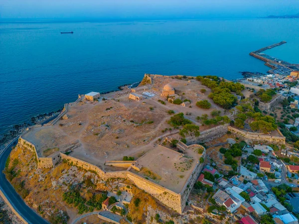 stock image Sunset aerial view of Venetian Fortezza Castle in Greek town Rethimno, Crete.