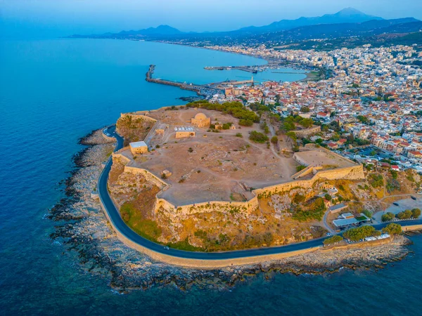 stock image Sunset aerial view of Venetian Fortezza Castle in Greek town Rethimno, Crete.