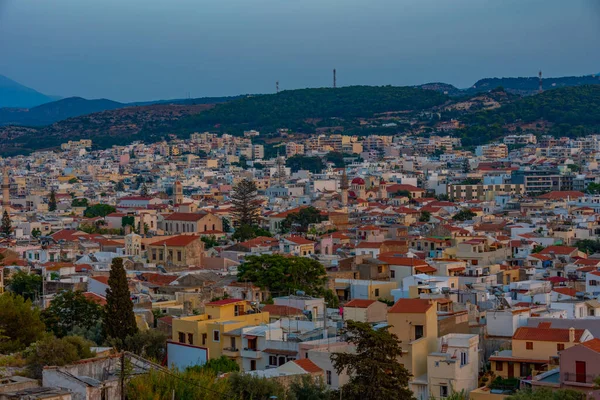 stock image Sunset view of rooftops of Greek town Rethimno at Crete island.