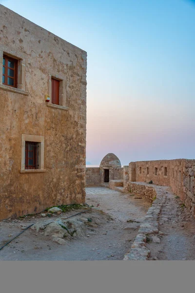 stock image Sunset view of buildings at Venetian Fortezza Castle in Greek town Rethimno, Crete.