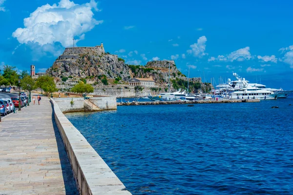 stock image View of the Palaio Frourio at the far end of waterfront promenade at Greek island Corfu.