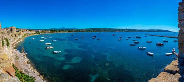 stock image Panorama of boats mooring alongside Methoni castle in Greece.