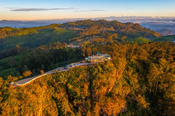 stock image Sunrise aerial view of Lipton's seat viewpoint and adjacent tea plantations at Sri Lanka.