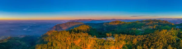 stock image Sunrise aerial view of Lipton's seat viewpoint and adjacent tea plantations at Sri Lanka.