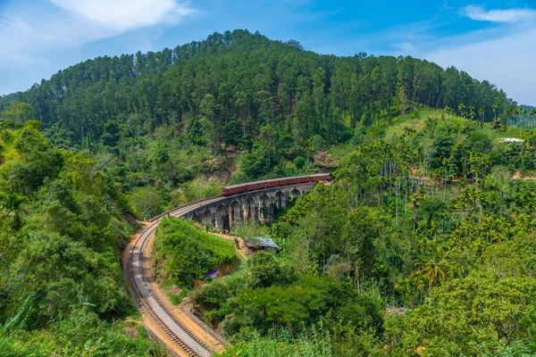 stock image Train passing the nine arch bridge near Ella, Sri Lanka.