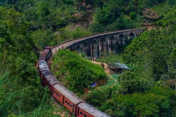 stock image Train passing the nine arch bridge near Ella, Sri Lanka.