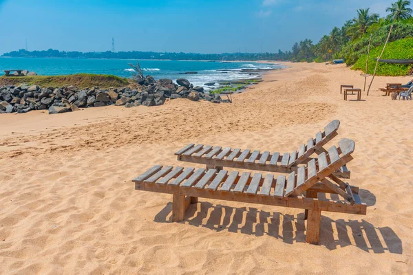 stock image Sunbeds at Marakolliya beach, Sri Lanka.