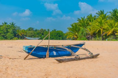 Fishing boats at Marakolliya beach, Sri Lanka. clipart