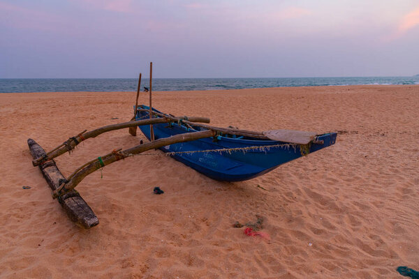 Fishing boats at Marakolliya beach, Sri Lanka.