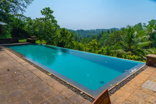 stock image Pool overlooking cinnamon fields at Mirissa Hills, Sri Lanka.