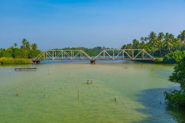 stock image Train crossing Koggala lagoon on a bridge, Sri Lanka.