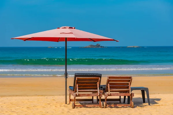 stock image Sunbeds at Bentota beach, Sri Lanka.