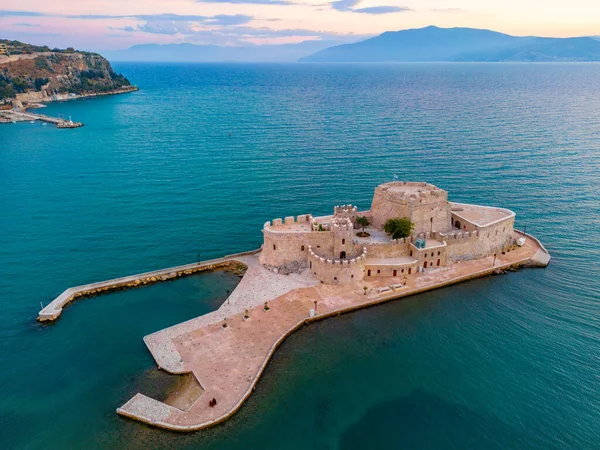 stock image Sunset view of Bourtzi fortress near Greek town Nafplio.