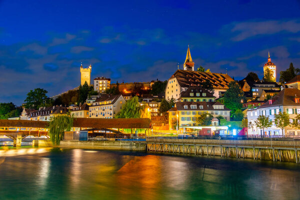 Night view of Spreuerbruecke and historical fortification at Swiss town Luzern.