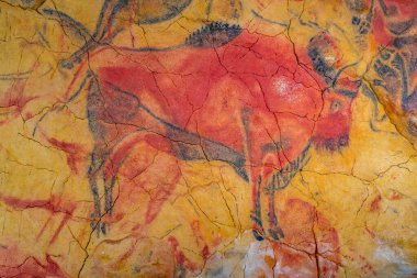 Santillana del Mar, Spain, June 12, 2022: Rock paintings at the replica of Altamira cave at Santillana del Mar in Spain. clipart