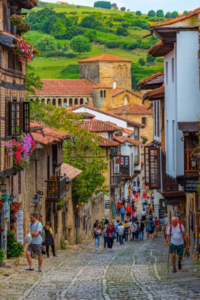 stock image Santillana del Mar, Spain, June 12, 2022: People are strolling through medieval streets of Santillana del Mar in Spain.