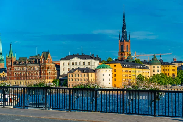 stock image Stockholm, Sweden, August 2, 2022: Gamla Stan old town dominated by Riddarholmskyrkan church in Stockholm, Sweden.