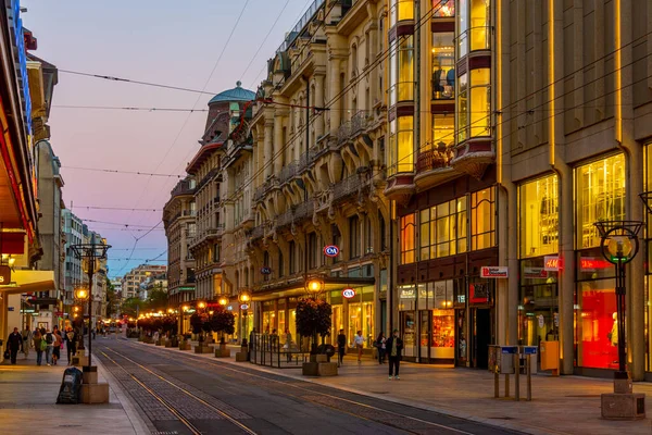 stock image Geneva, Switzerland, September 19, 2022: Sunset view of a street in downtown of the swiss city Geneva, Switzerland.