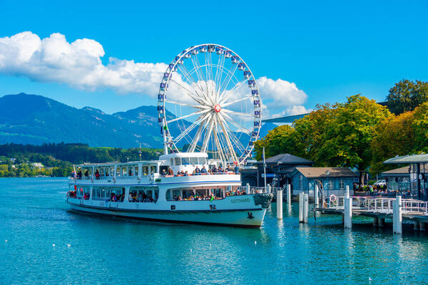 Luzern, Switzerland, September 20, 2022: Ferris wheel in front of the Culture and Congress center in Luzern, Switzerland.