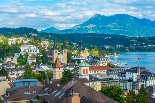 stock image Luzern, Switzerland, September 20, 2022: Waterfront of lake Lucerne with a church in Luzern, Switzerland.