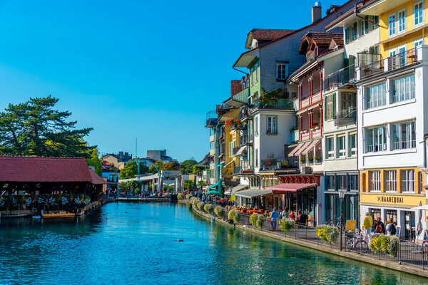 Thun, Switzerland, September 22, 2022: Colorful houses at riverside of Aare river in Thun Switzerland.