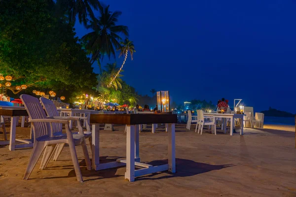 stock image Mirissa, Sri Lanka, January 22, 2022: Sunset view of a beach restaurant at Mirissa beach, Sri Lanka.