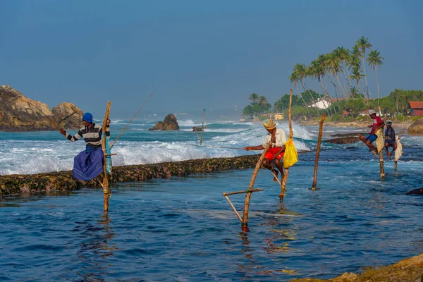 stock image Koggala, Sri Lanka, January 21, 2022: Sunset view of traditional stilt fishermen in Koggala, Sri Lanka.