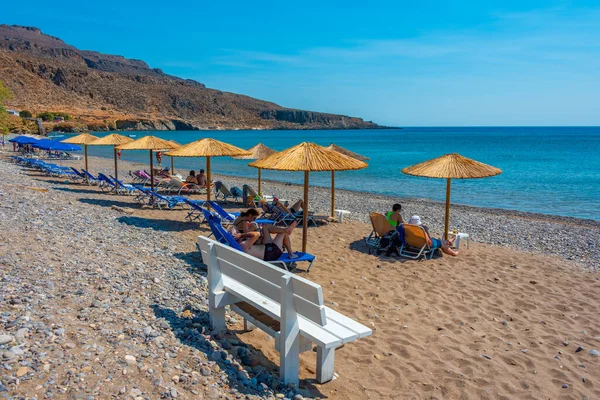 stock image Kato Zakros, Greece, August 19, 2022: Parasols and sunbeds at Kato Zakros beach at Crete, Greece.