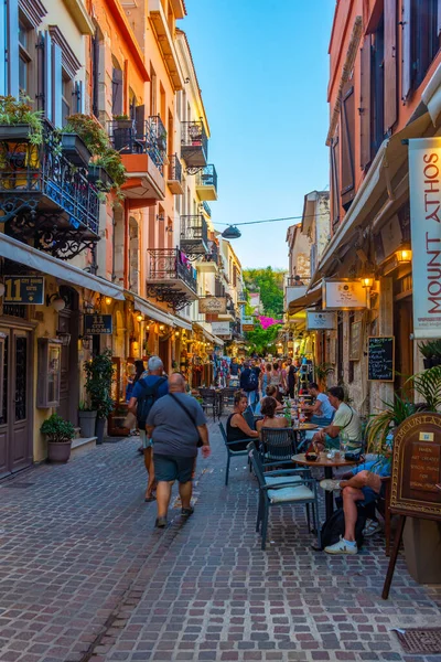 stock image Chania, Greece, August 21, 2022: Sunset view of a tourist street in Greek town Chania at Crete island.