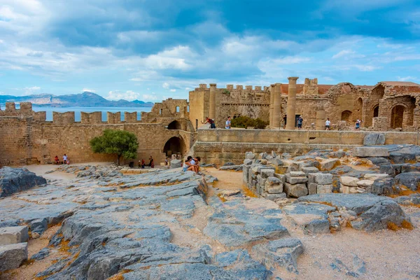 stock image Lindos, Greece, August 25, 2022: View of Lindos Acropolis at Greek island Rhodes.