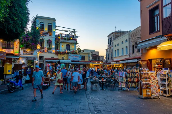 stock image Rhodes, Greece, August 27, 2022: Sunset view of a tourist street in Greek town Rhodes.