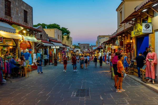 stock image Rhodes, Greece, August 27, 2022: Sunset view of a tourist street in Greek town Rhodes.