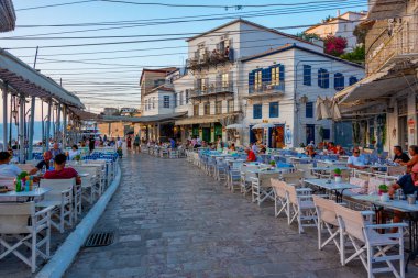 Hydra, Greece, September 4, 2022: Sunset view of a seaside promenade at the port of Hydra in Greece. clipart