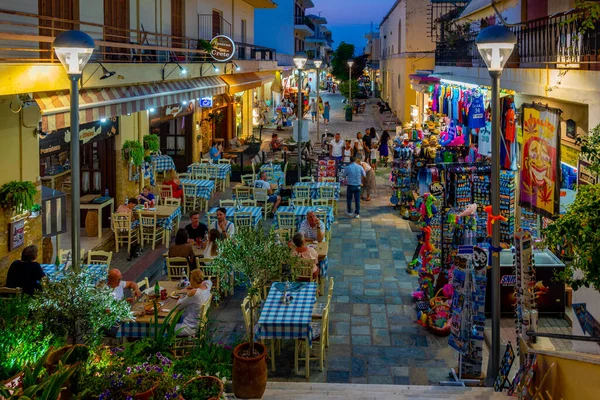 stock image Kos, Greece, August 28, 2022: Sunset view of a tourist street in Greek town Kos.
