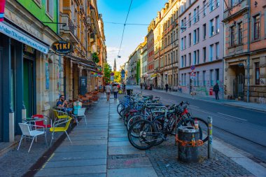 Dresden, Germany, August 6, 2022: Sunset view of a commercial street in German town Dresden Neustadt. clipart