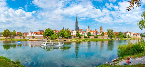 stock image Ulm, Germany, August 16, 2022: Cityscape of German town Ulm reflecting on river Danube.