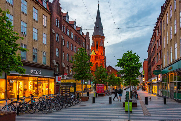 Aarhus, Denmark, June 14, 2022: Night view of a street in central Aarhus, Denmark.