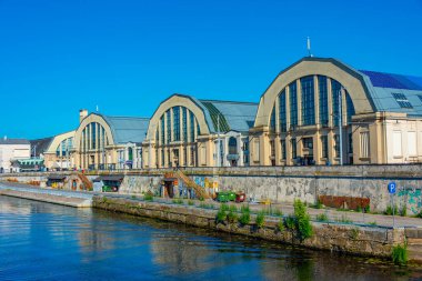 Riga, Latvia, June 24, 2022: View of the former zeppelin hangars now convereted into the Riga market - Rigas Centraltirgus. clipart