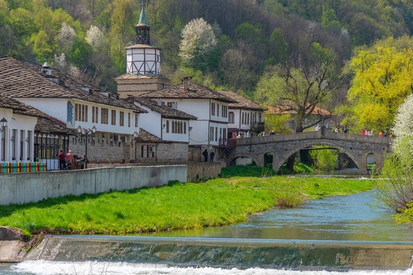 stock image Tryavna, Bulgaria, April 24, 2022: historical clock tower in the center of Tryavna behind a river, Bulgaria.