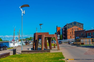 Liepaja, Latvia, July 3, 2022: Industrial infrastructure alongside a channel in Liepaja, Latvia. clipart