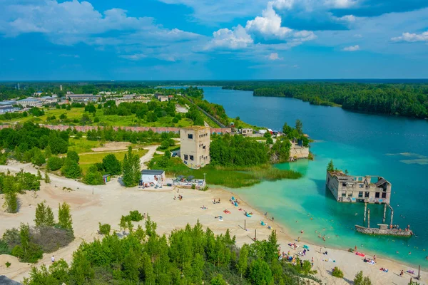 stock image Rummu, Estonia, June 30, 2022: People are enjoying a sunny day at a beach at Rummu quarry in Estonia.