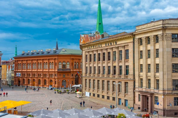 stock image Riga, Latvia, July 9, 2022: People are strolling through Doma Laukums square full of restaurants in the Latvian capital Riga..