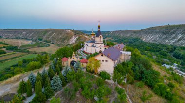 Sunset panorama of St. Mary's Church at Orheiul Vechi in Moldova clipart
