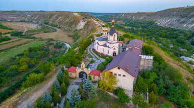Sunset panorama of St. Mary's Church at Orheiul Vechi in Moldova clipart