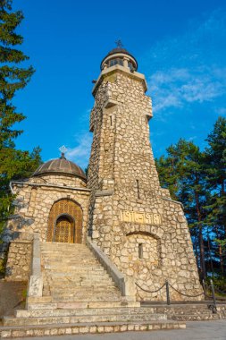 Mausoleul Mateias during a sunny evening in Romania clipart