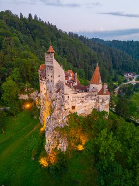Sunset view of Bran castle in Romania clipart