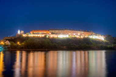 Night view of Petrovaradin fortress in Serbian town Novi Sad clipart