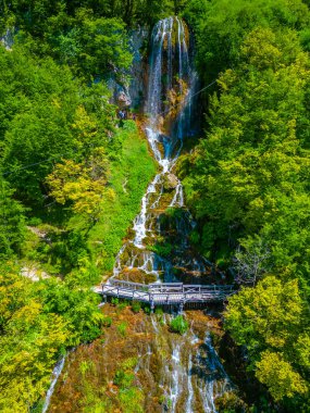 Sopotnica waterfall in Serbia during a summer sunny day clipart